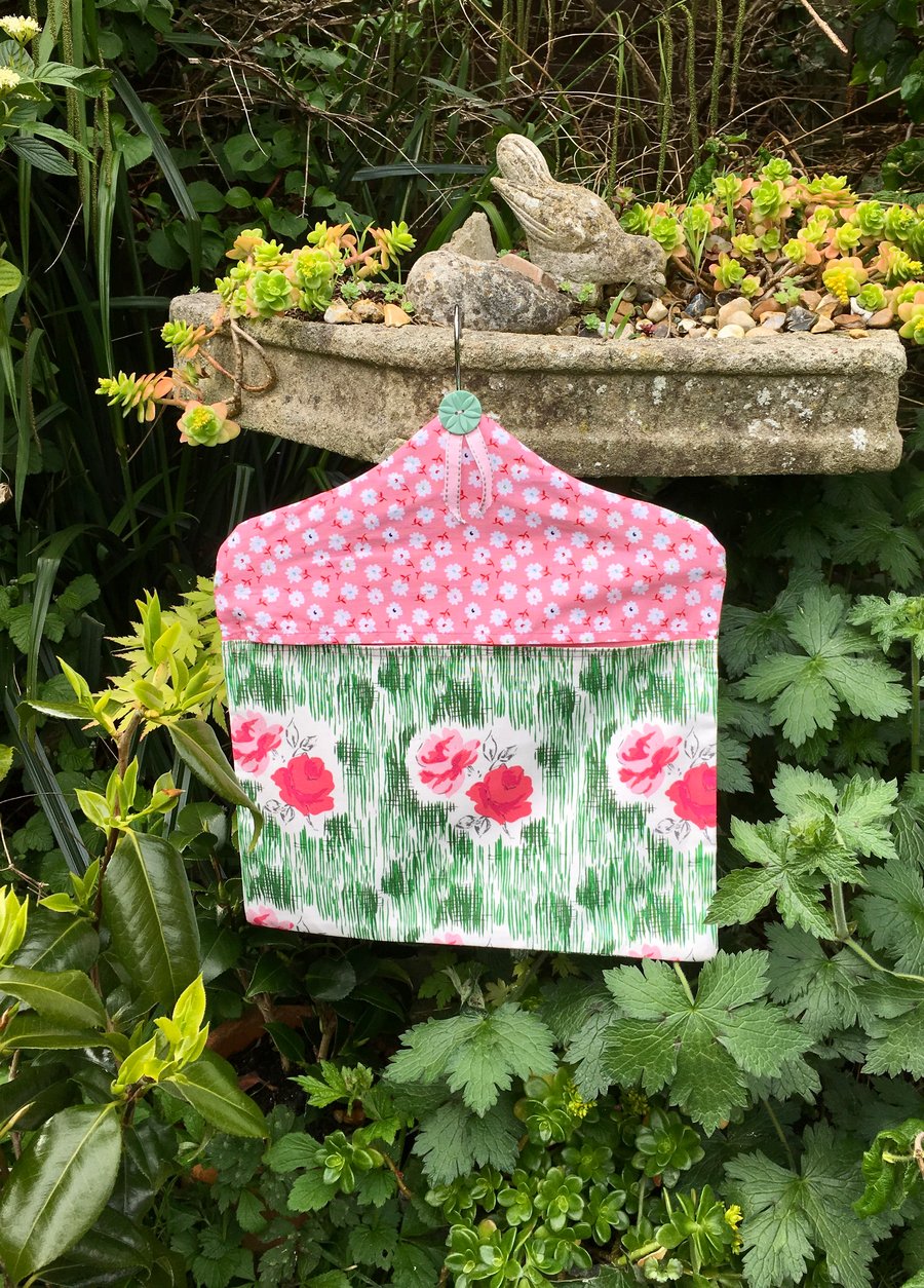 Peg bag in a retro theme pink and green rose design. Free UK P & P. Wash day bag