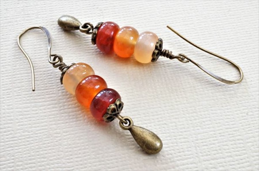 Shades of orange gemstone earrings with carnelian and antique bronze.
