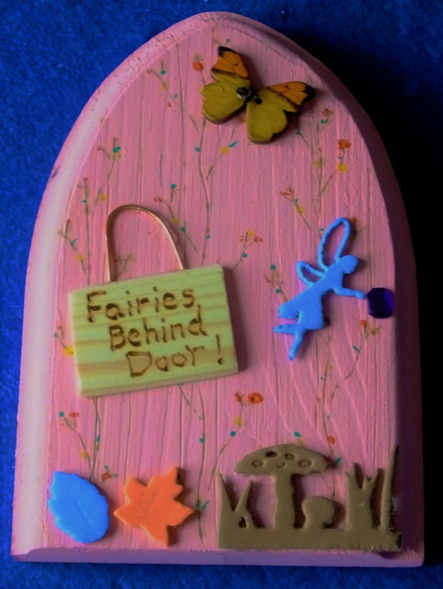 Magical fairy or hobbit handcrafted door to let the fairies into home or garden 