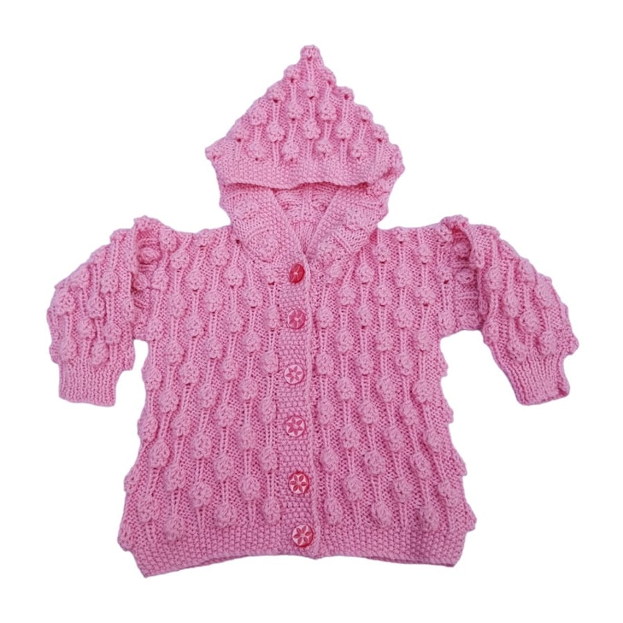 Baby cardigan in pink with hood and bobble pattern to fit 6 - 12 months 