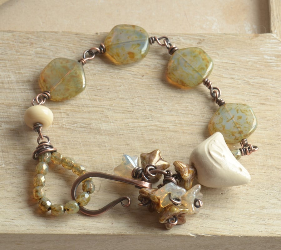 Bird Song Ceramic Cream Bird, Lampwork and Glass Bead Copper Bracelet