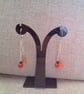 Earrings with Orange Artemis Beads Red and Black Beads on Long Chains - Image 5