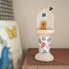 Little Wooden House on a Floral Wooden Bobbin 