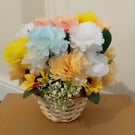 Artificial Flowers set in wicker basket