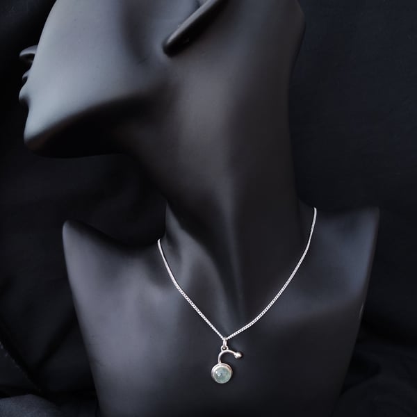 Silver pendant with prehnite