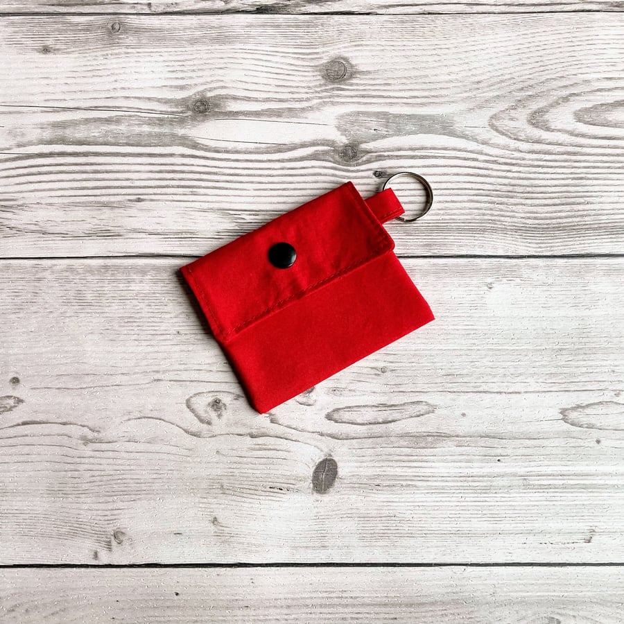 Plain red colour round lip balm keyring, keychain. Lipstick holder.