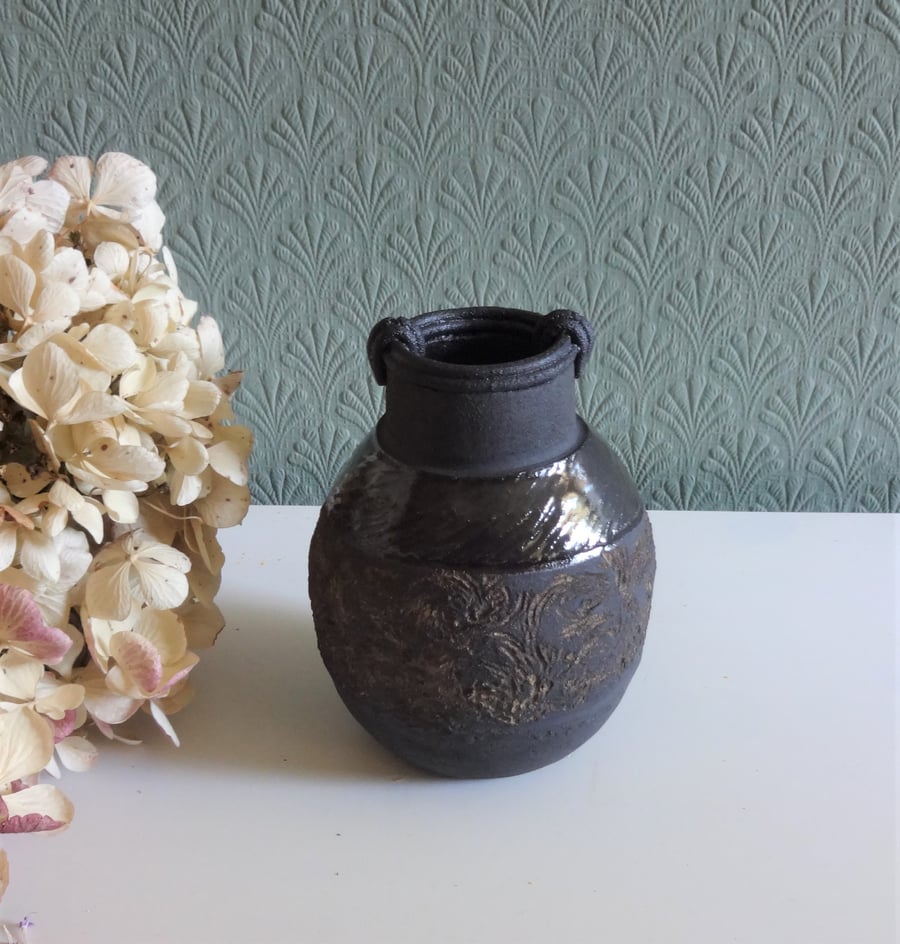 Handmade black ceramic moon jar with antique oriental design vibes.