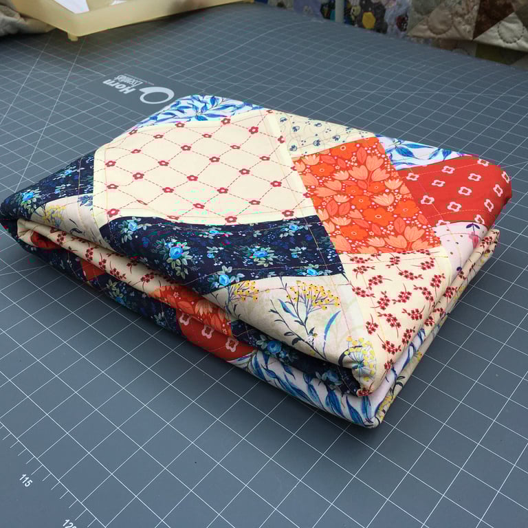 Medium-weight Bedcover. Patchwork Rectangles, Oranges, Creams, Blue Leaves.