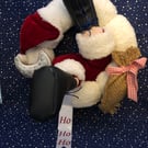 Santa’s stuck in the Christmas wreath!