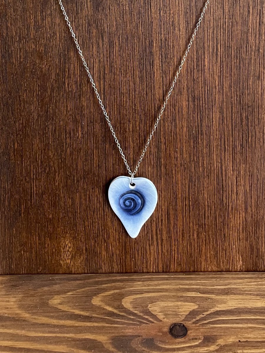 Porcelain heart necklace with a blue spiral