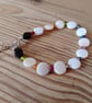 Handmade bracelet made using pre-loved beads.