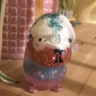 White and blue hat knitted effect resin and glitter capybara