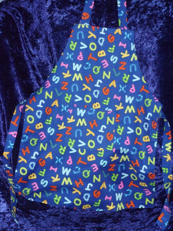 Childs Apron with Colourful Alphabet on Blue