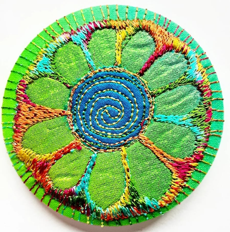 58mm Fabric Badge with Free Machine Embroidery Green and Blue Flower 