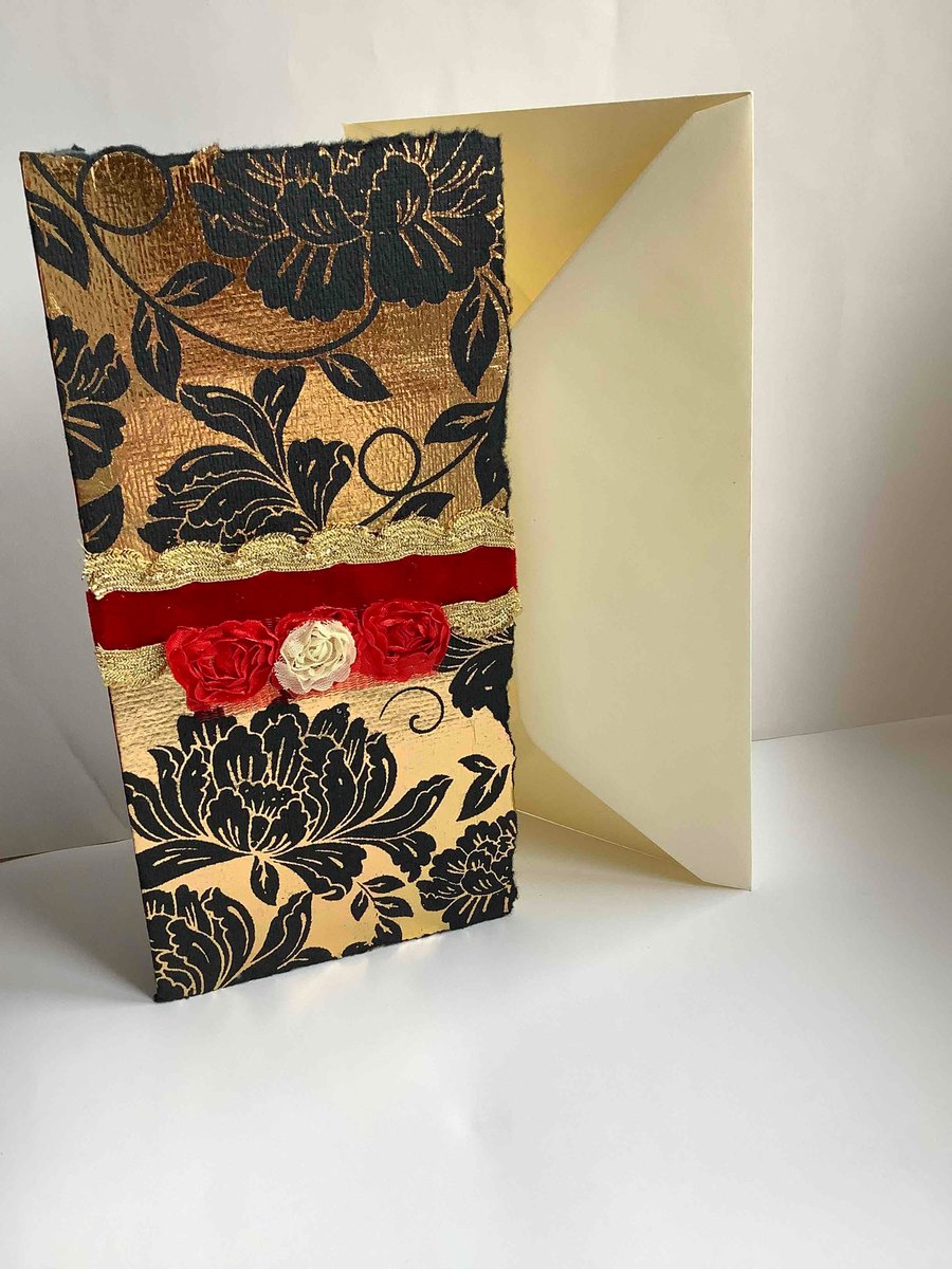 Glamorous golden card with black flowers