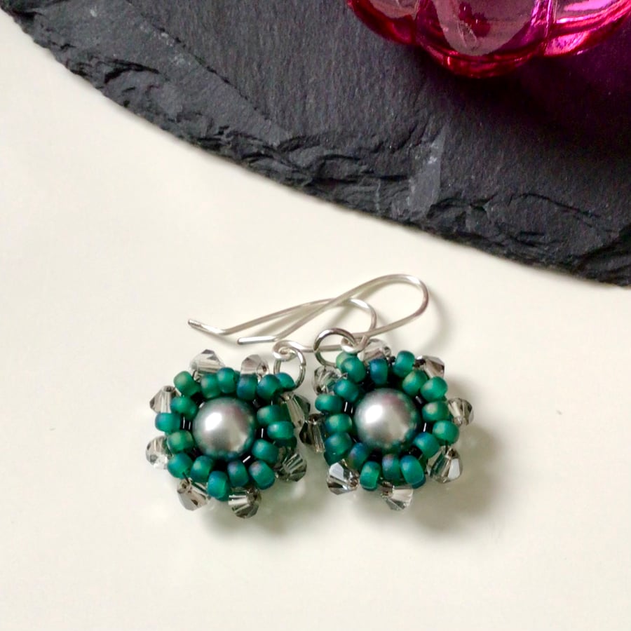 Beaded green and silver wheel earrings