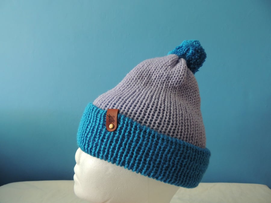 Blue woolen hand knitted hat with pompom
