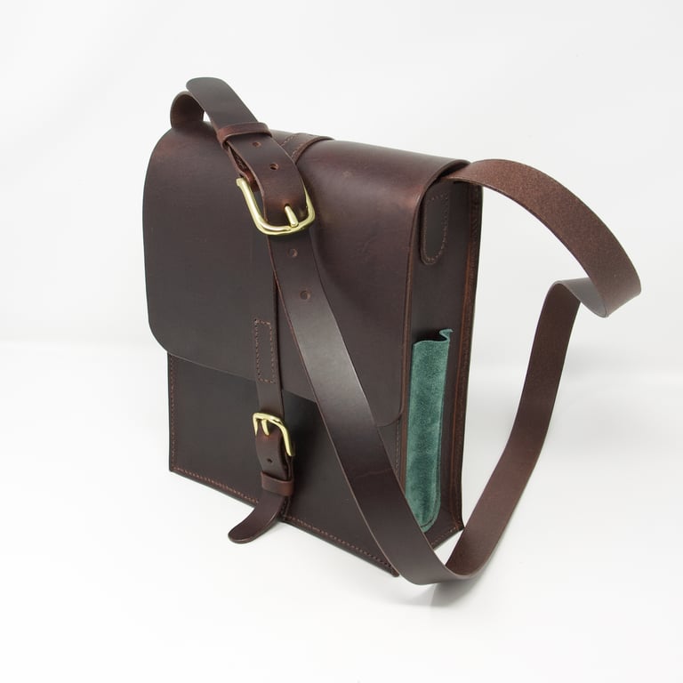 Brown leather shoulder bag with solid brass hardware