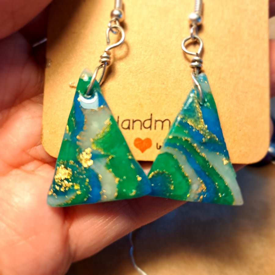 Triangular pair of green, white, blue and gold earrings