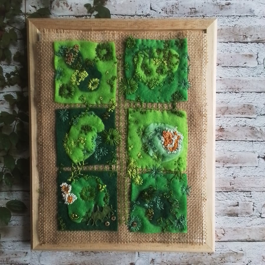 Hand embroidered artwork of moss and lichen 
