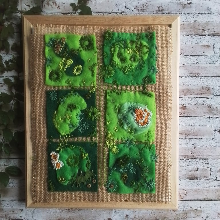Hand embroidered artwork of moss and lichen 