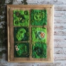 Hand embroidered artwork of moss and lichen 