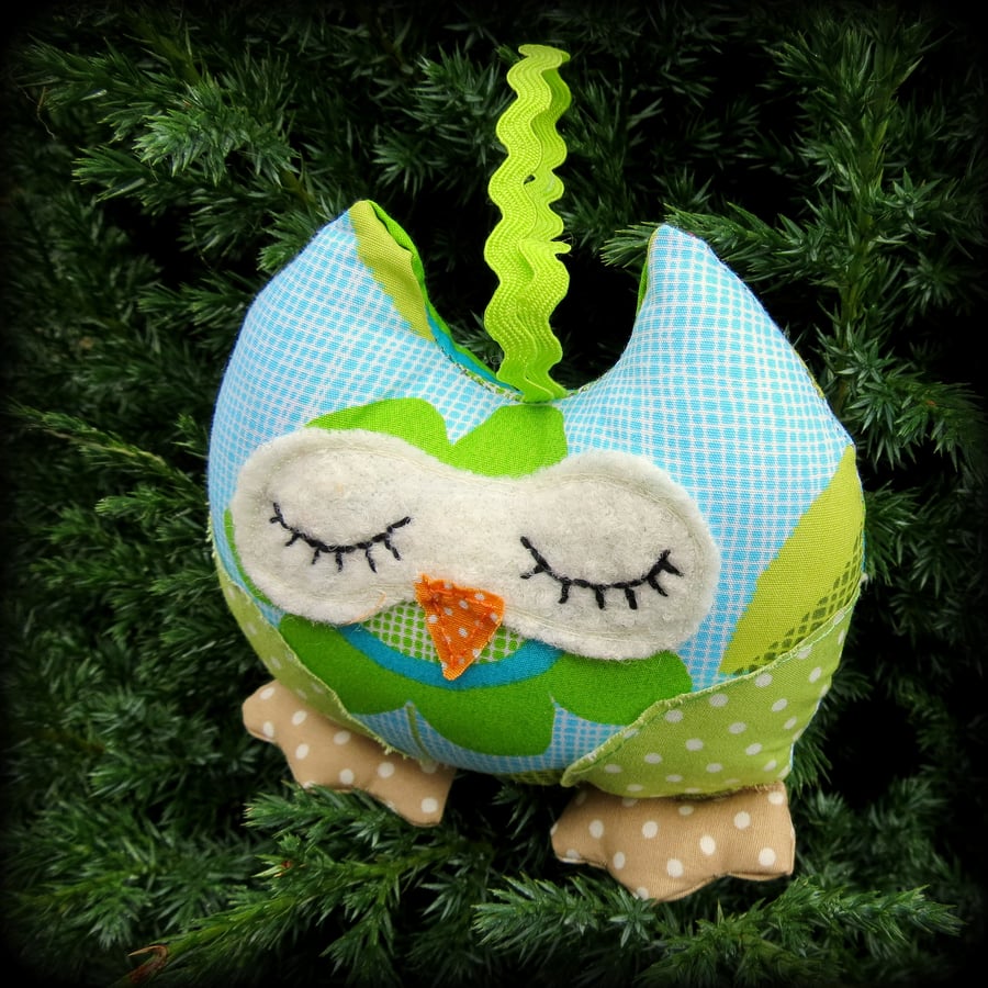 A snoozy owl to hang from a window or cupboard.