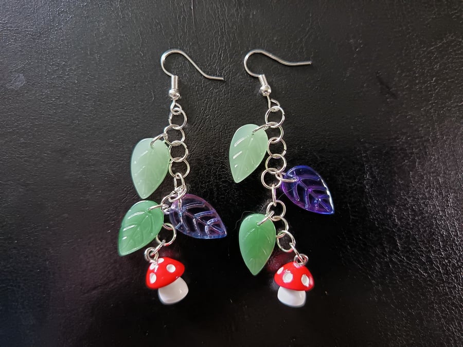 Cottagecore red and white toadstool charm leafy dangle earrings 