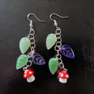 Cottagecore red and white toadstool charm leafy dangle earrings 
