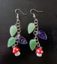 Cottagecore red and white toadstool charm leafy dangle earrings 