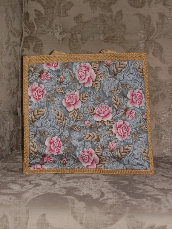Jute Bag with a Fabric Pocket featuring Pink Roses on a Grey Background