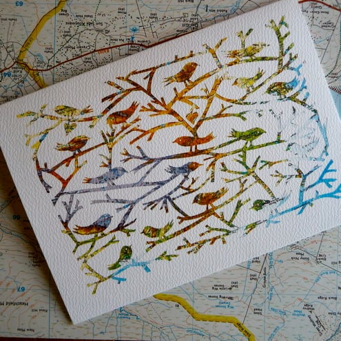 Birds Of A Feather, papercut on vintage map