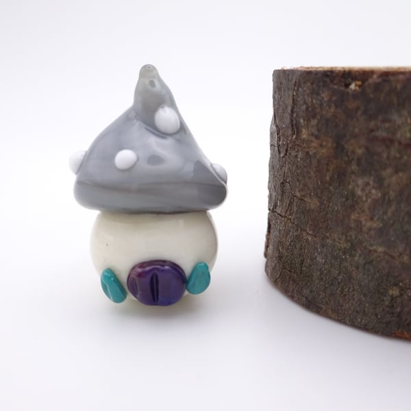small glass toadstool house