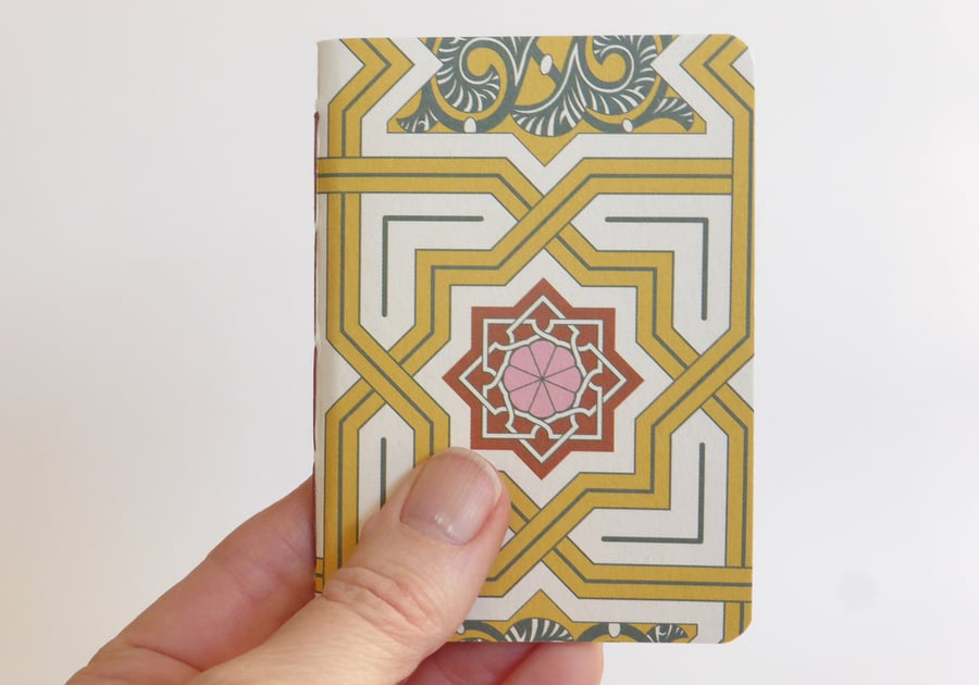 Small hand bound A7 notebook or sketchbook with yellow and red patterned cover