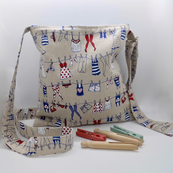 Cross body bag hands free peg bag washing line print with draw string top.