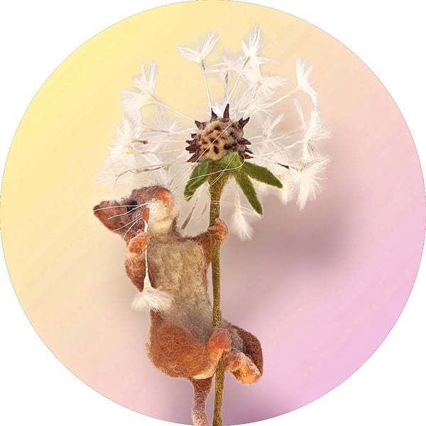 Felted harvest mouse & dandelion clock displayed on wooden rustic cotton bobbin.