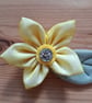 Handmade kanzashi fabric flower brooch - Image 1