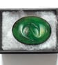 enamelled brooch - oval, scrolled white, gold and purple on green over clear - Image 2