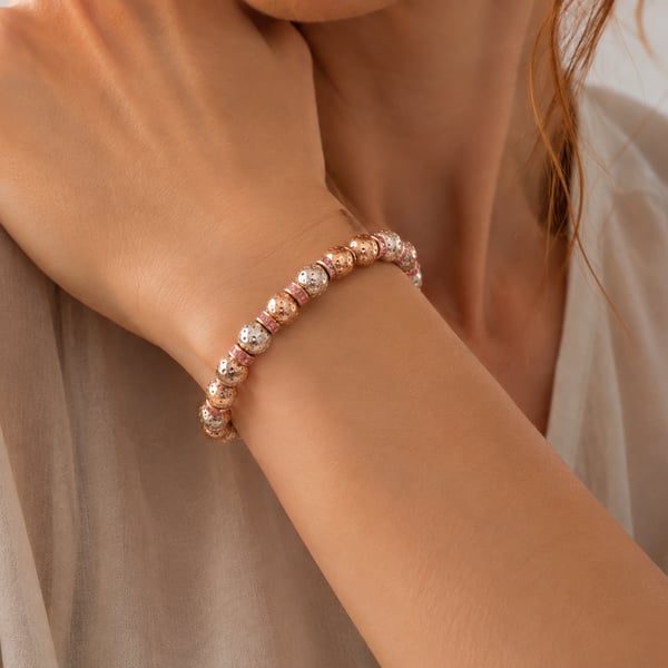Gold coloured lava beads and pink crystal rondelles stretchy bracelet