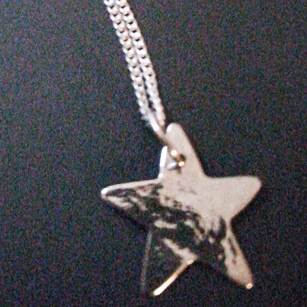 Sterling silver star pendant.
