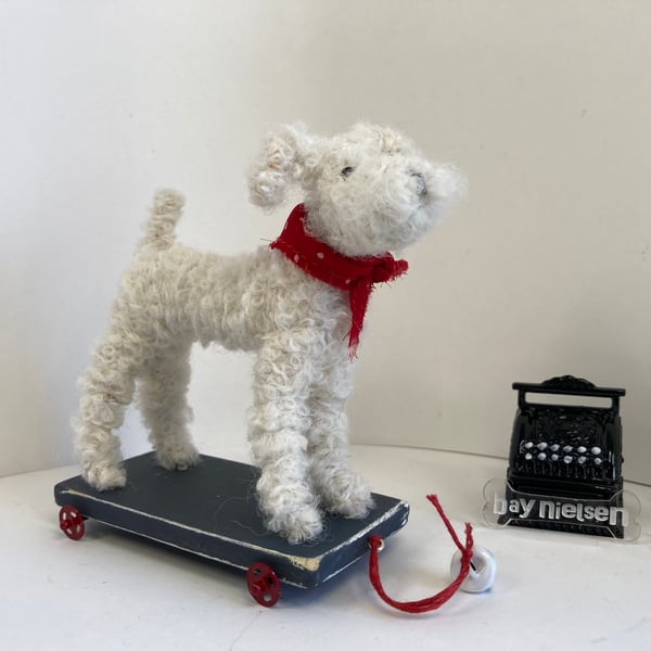 Miniature Dog on a Wooden Trolley. 