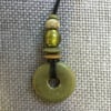 “Womanhood” recycled glass bead pendant in Olive