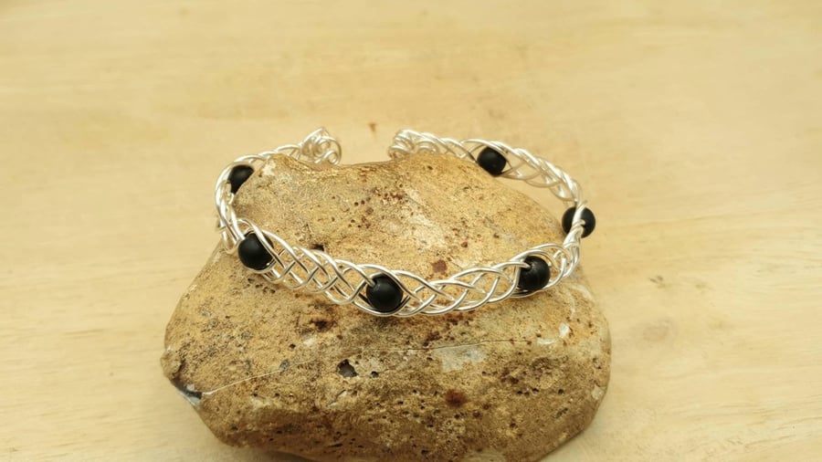 Adjustable Wire wrap Shungite cuff bracelet. Celtic knot weave