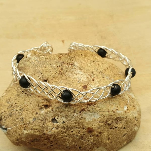 Adjustable Wire wrap Shungite cuff bracelet. Celtic knot weave