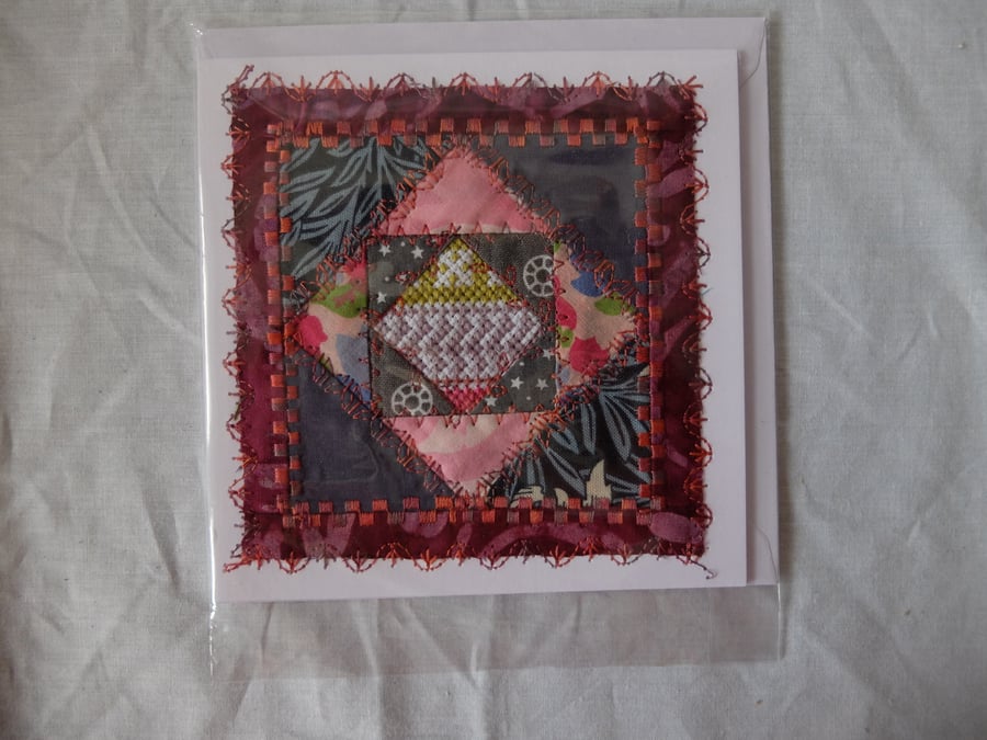 hand made card, quilt block with fragment of cross stitch to centre