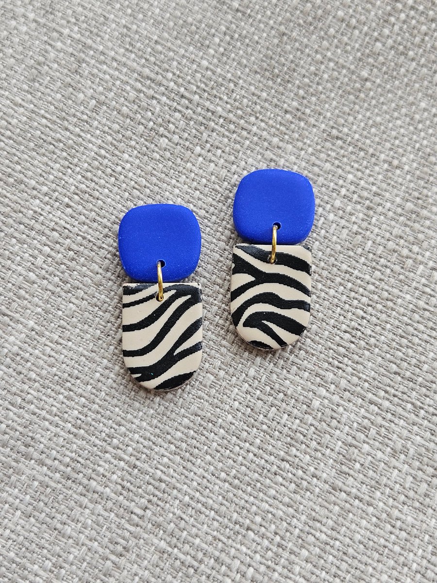 Blue animal print dangly earrings