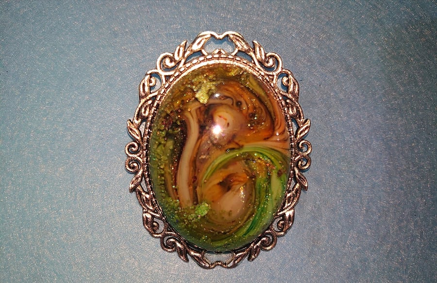 Oval swirly resin brooch