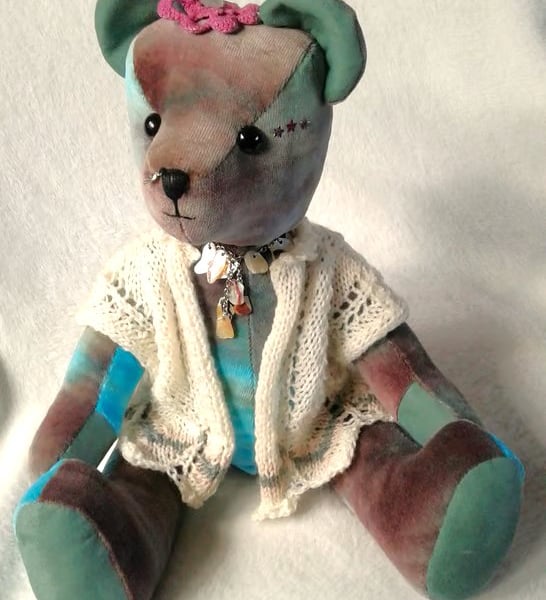 Ocean, a unique collectable velvet bear with a hand knitted lace jacket.