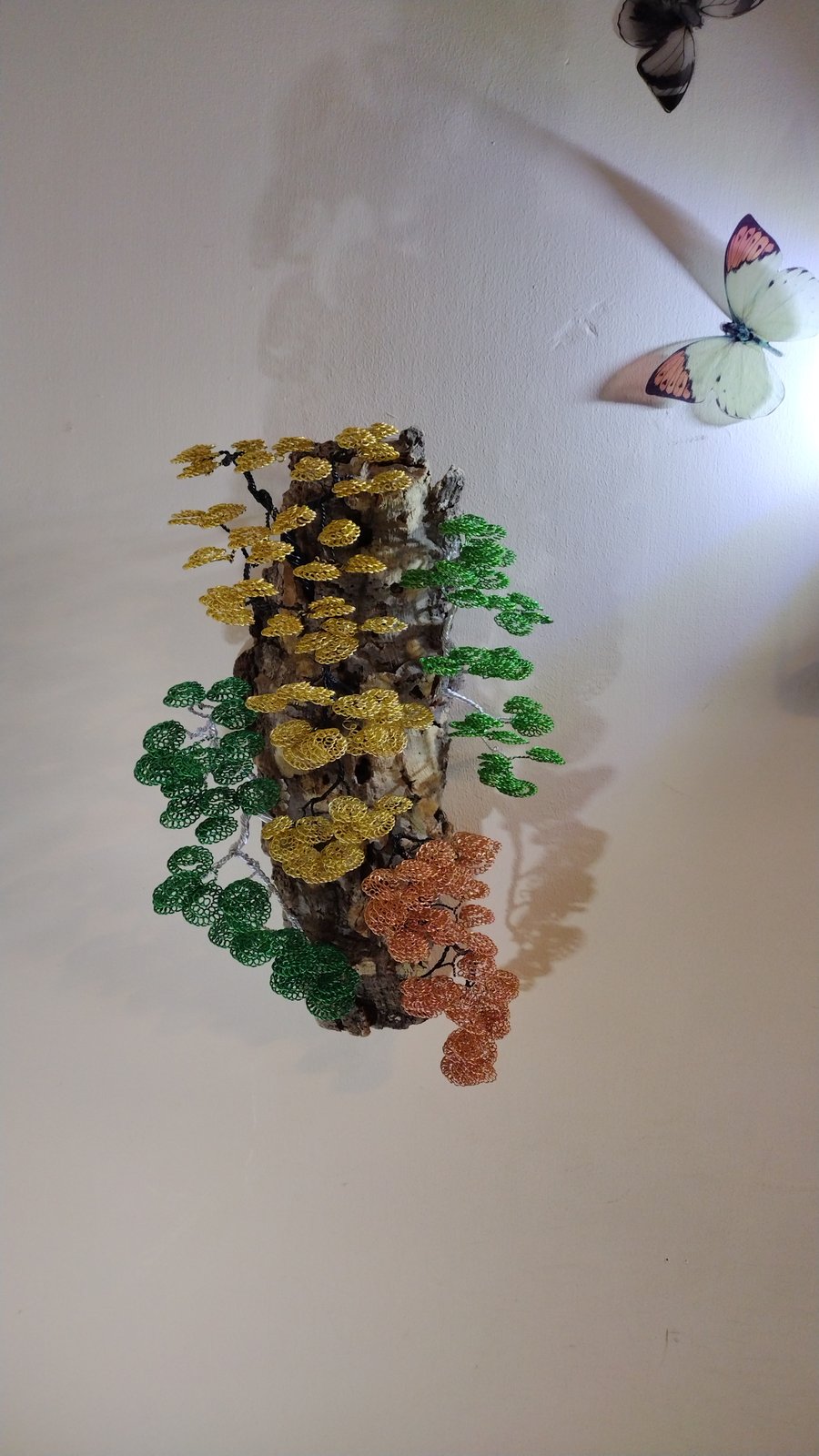 Cascading multiple bonsai trees on cork bark 