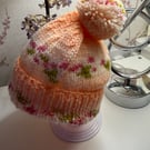 Knitted baby hat with rib and Pom Pom.